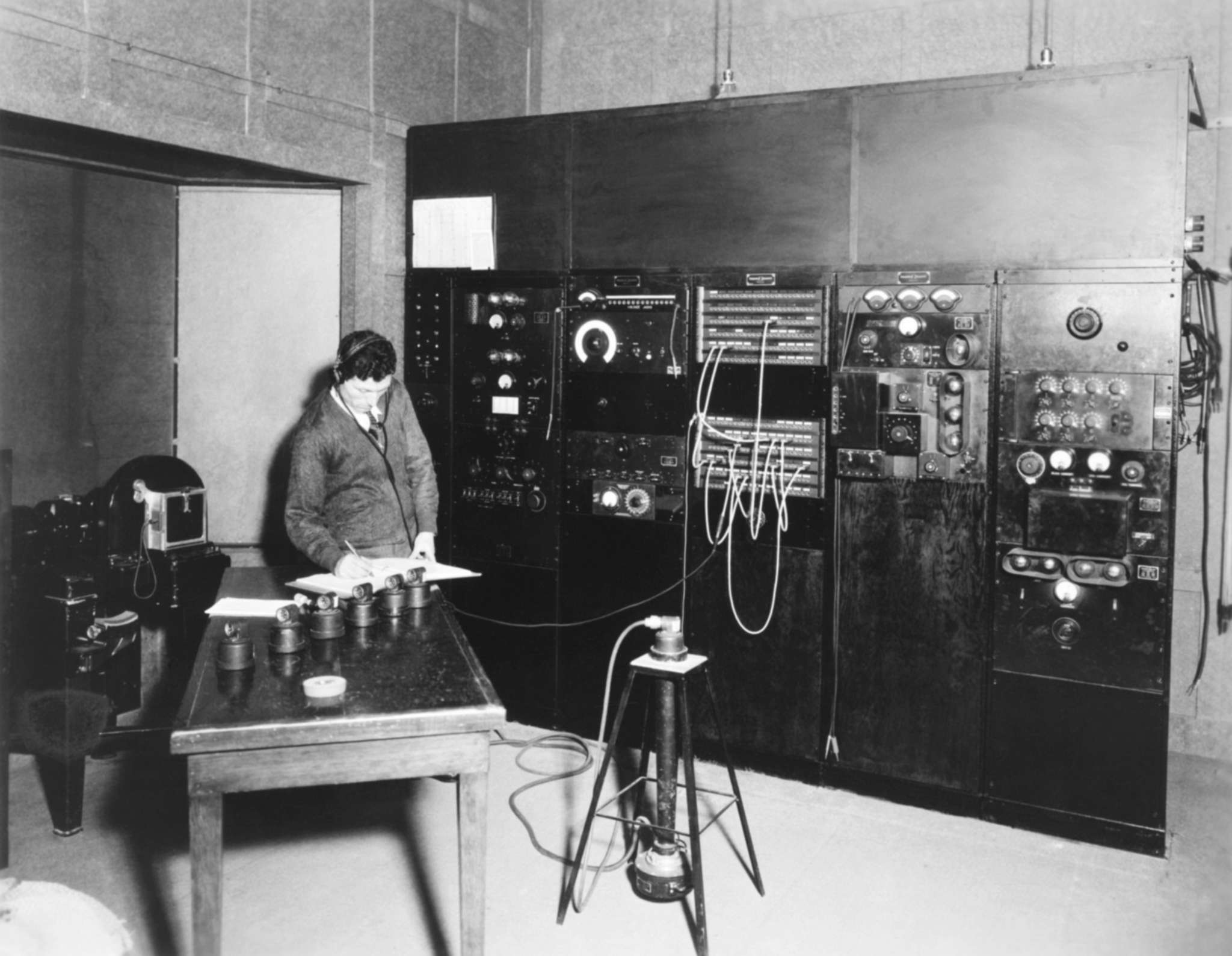 Sound engineer Harry Proodian testing microphones in a Fox motion picture studio